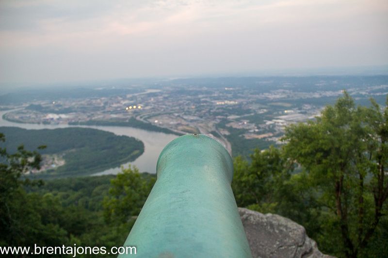 Cannon barrel points toward the river below