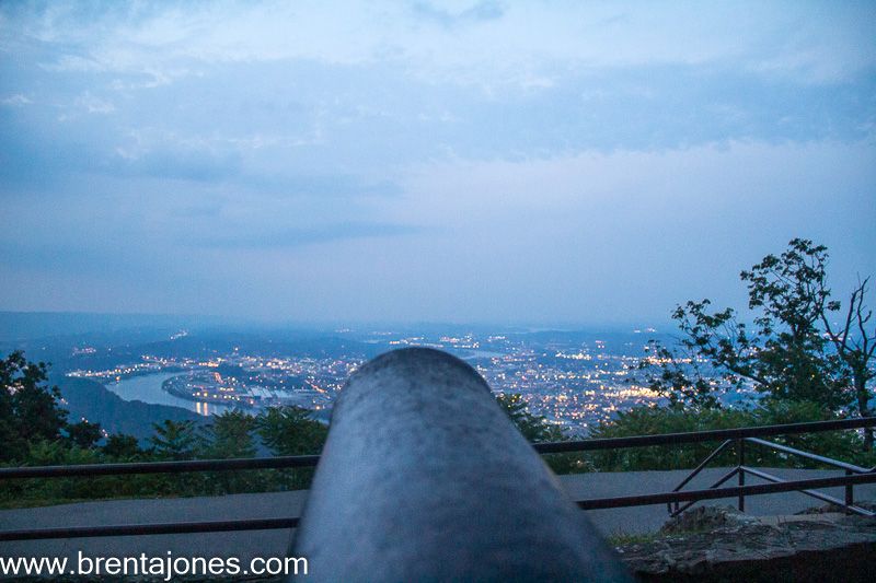 Cannon silhouette against a pale blue horizon